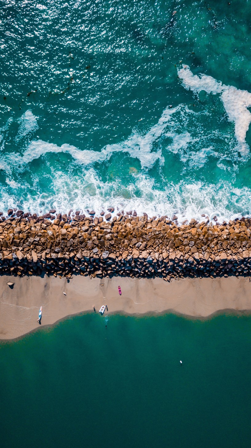 A thumbnail of an aerial view of a beach with rocks and people recreating, which provides more information about the topic Coastal regulations